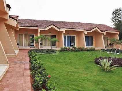 Farmhouse cottages with a landscaped lawn and garden pathway